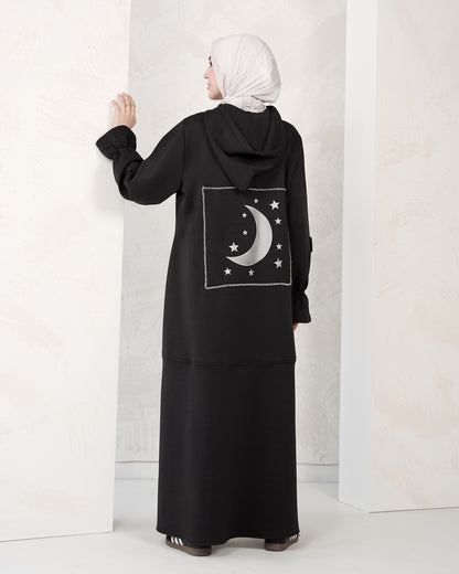 The dress features a comfortable, loose-fitting silhouette that flatters all body types, with delicately detailed sleeves adding a refined feminine touch